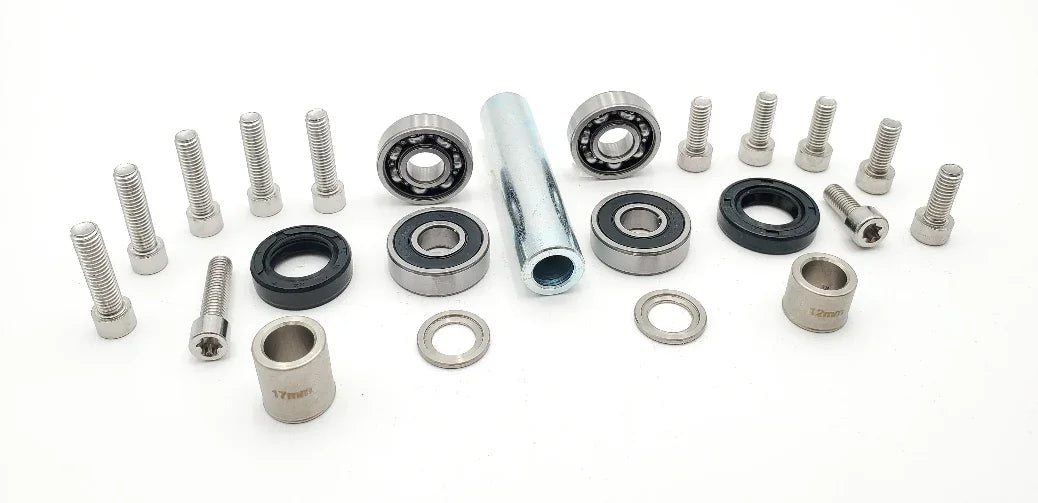 Warp 9 Surron Light Bee jack shaft rebuild kit with bolts, spacers, bearings, and seals