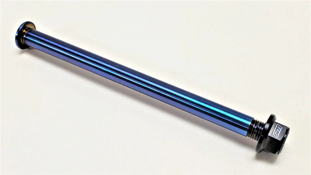 Warp 9 Surron LBX Titanium rear axle and black Fuji lock nut with burnt blue anodized finish