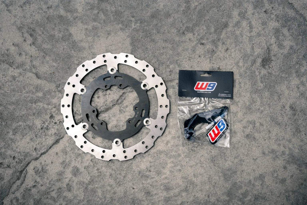 Warp 9 Ultra Bee 300mm rotor and caliper bracket for enhanced braking performance on Surron Ultra Bee Supermoto bike