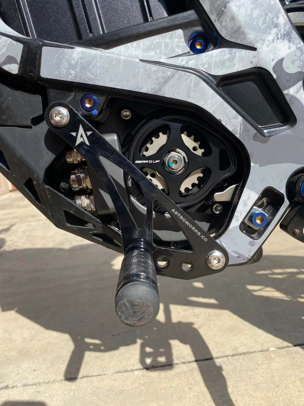 Surron Light Bee Shift Lock V2 by Astroworks Co with adjustable peg bracket and powdercoat protection
