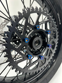 Surron Ultra Bee sprocket with blue titanium bolts