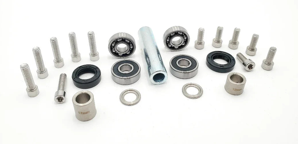 Warp 9 Surron Light Bee jack shaft rebuild kit with bolts, spacers, bearings, and seals