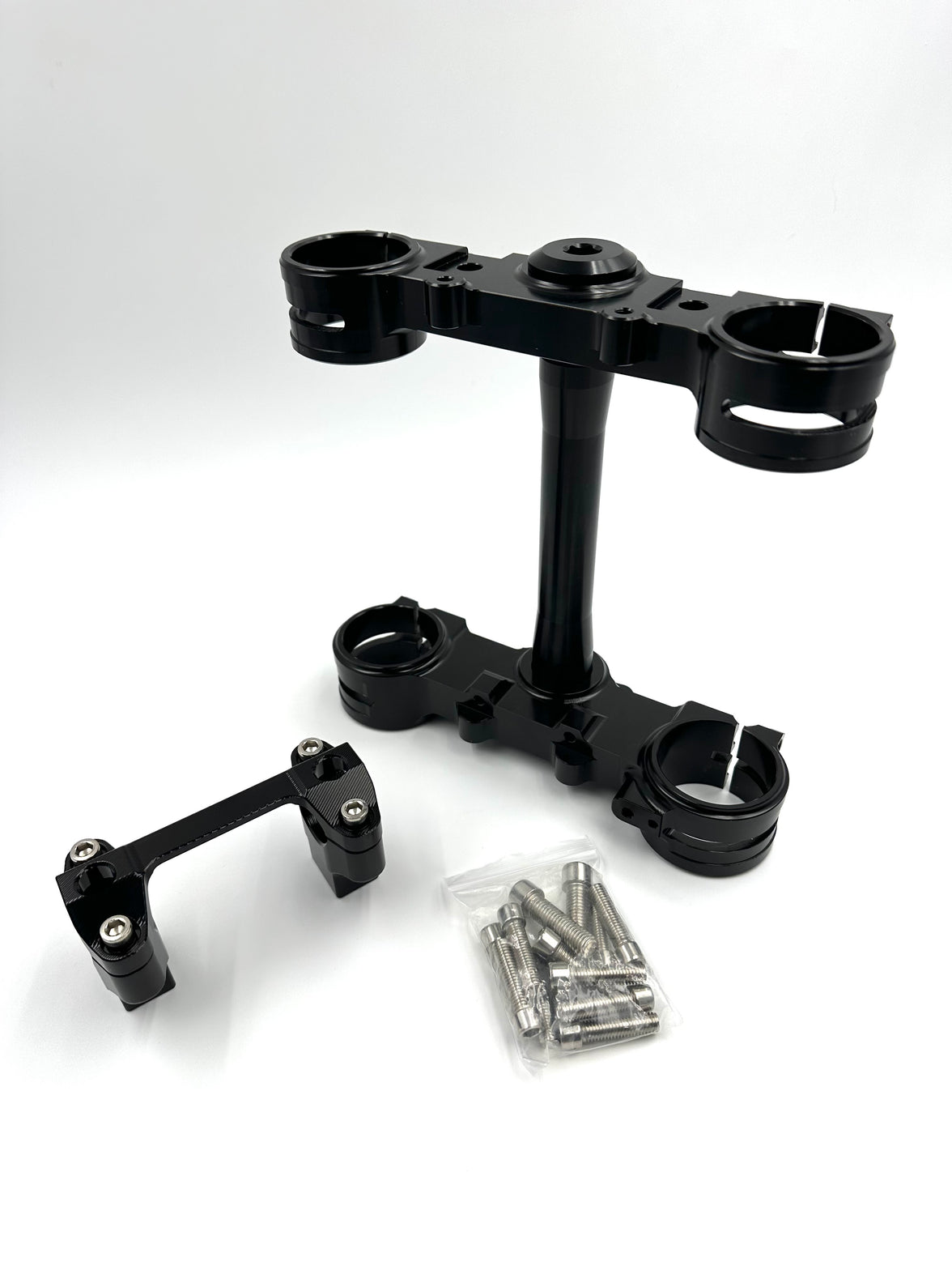 Black Surron Ultra Bee triple clamp and handlebar mount with hardware