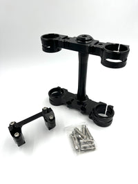 Black Surron Ultra Bee triple clamp and handlebar mount with hardware
