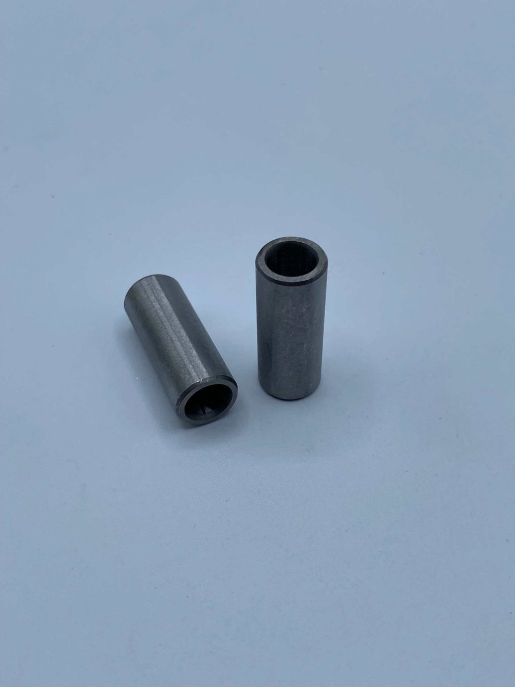 Surron LBX linkage bushing reducing suspension play in red color
