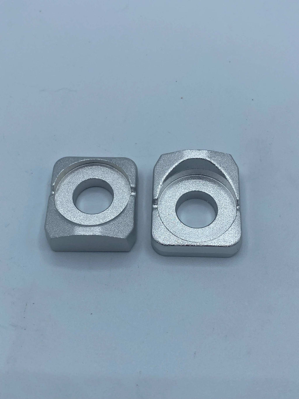OEM Surron Light Bee rear axle adjuster blocks pair without screws