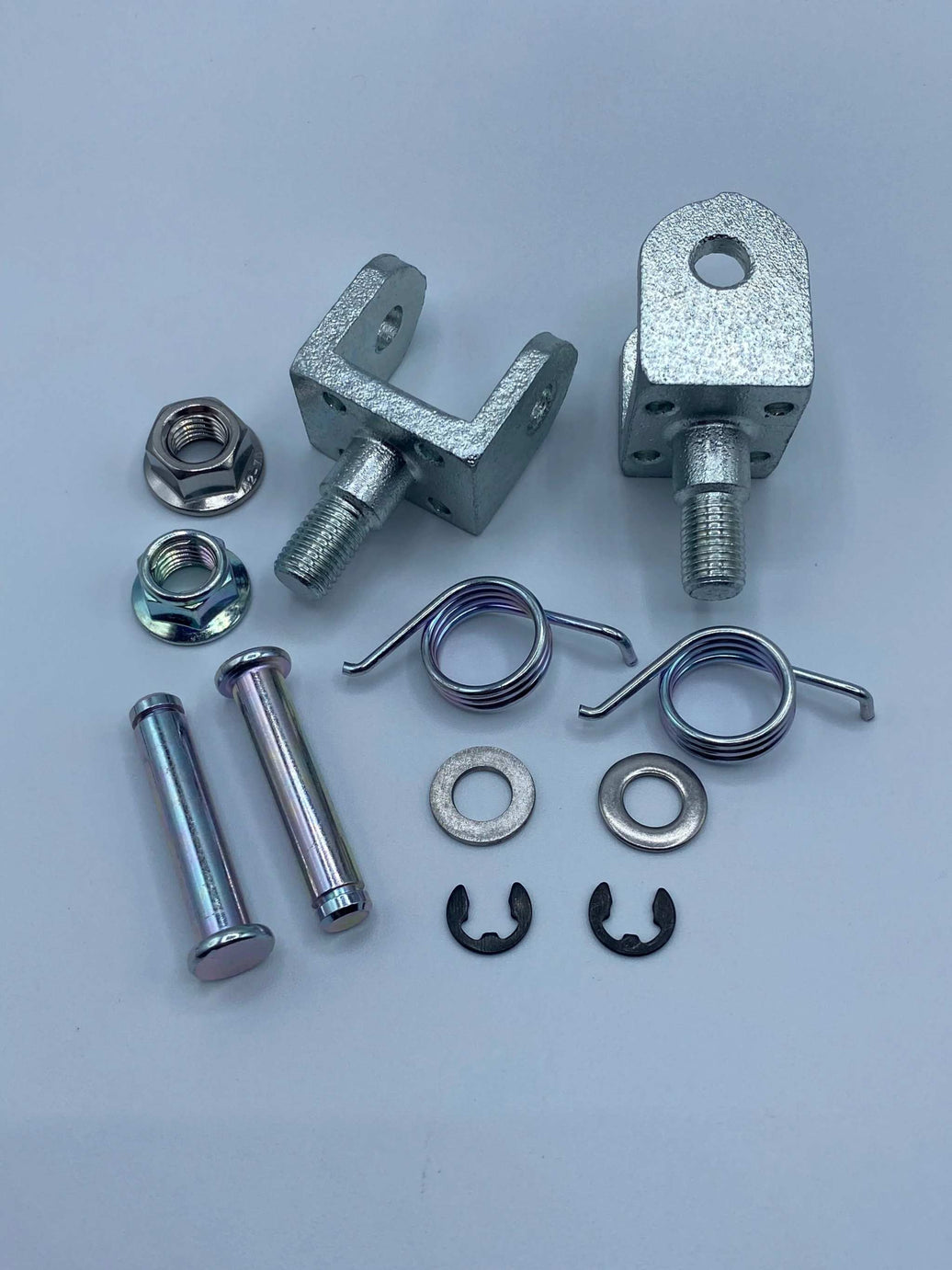 Complete OEM Foot Peg Hardware Kit with mounting pins, springs, clip set, and brackets for Surron, Talaria, and E-Ride Pro models