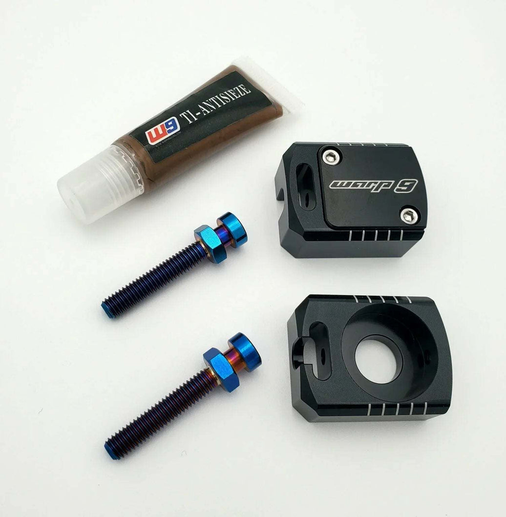 Warp 9 Surron LBX Lockdown axle blocks with titanium bolts and steel backing plate