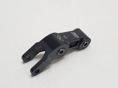 Warp 9 Surron Rear Suspension Linkage Riser V2 made of forged 7075T6 aluminum with hardened stainless steel bushings and ABEC 5 bearings