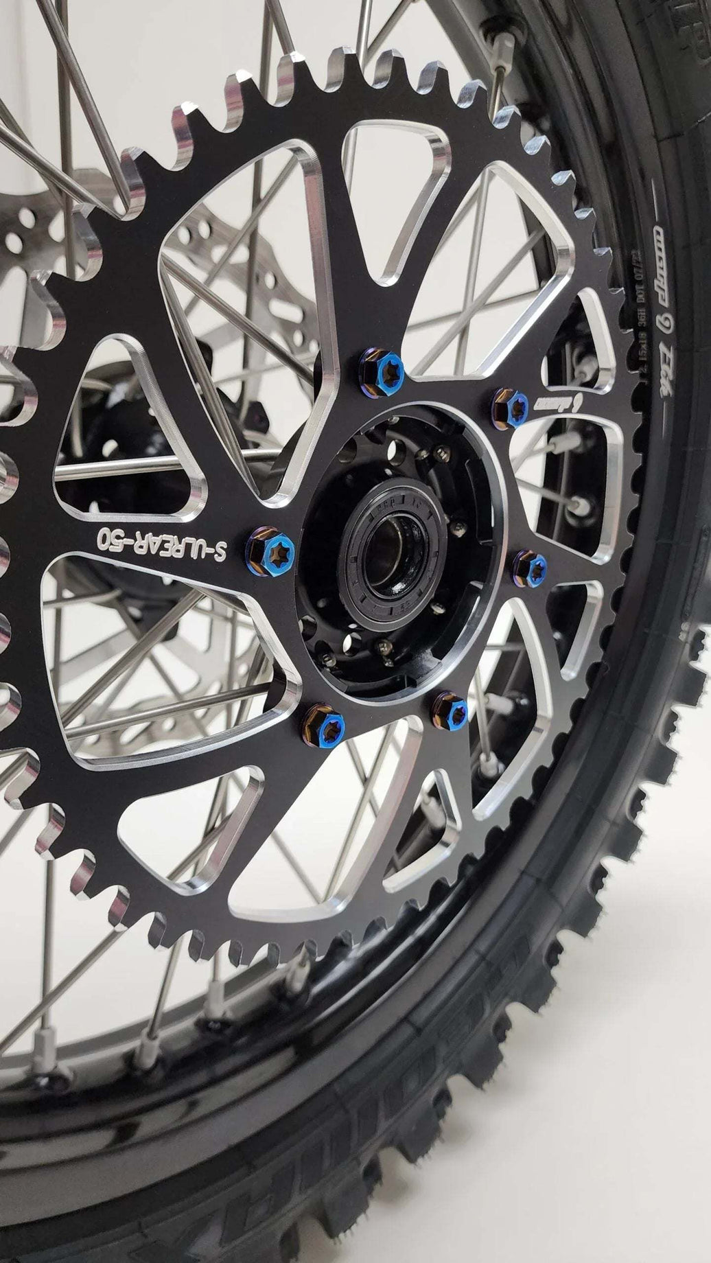 Warp 9 Surron Ultra burnt titanium rear sprocket bolts with 10MM Torx heads and blue thread lock, set of 6